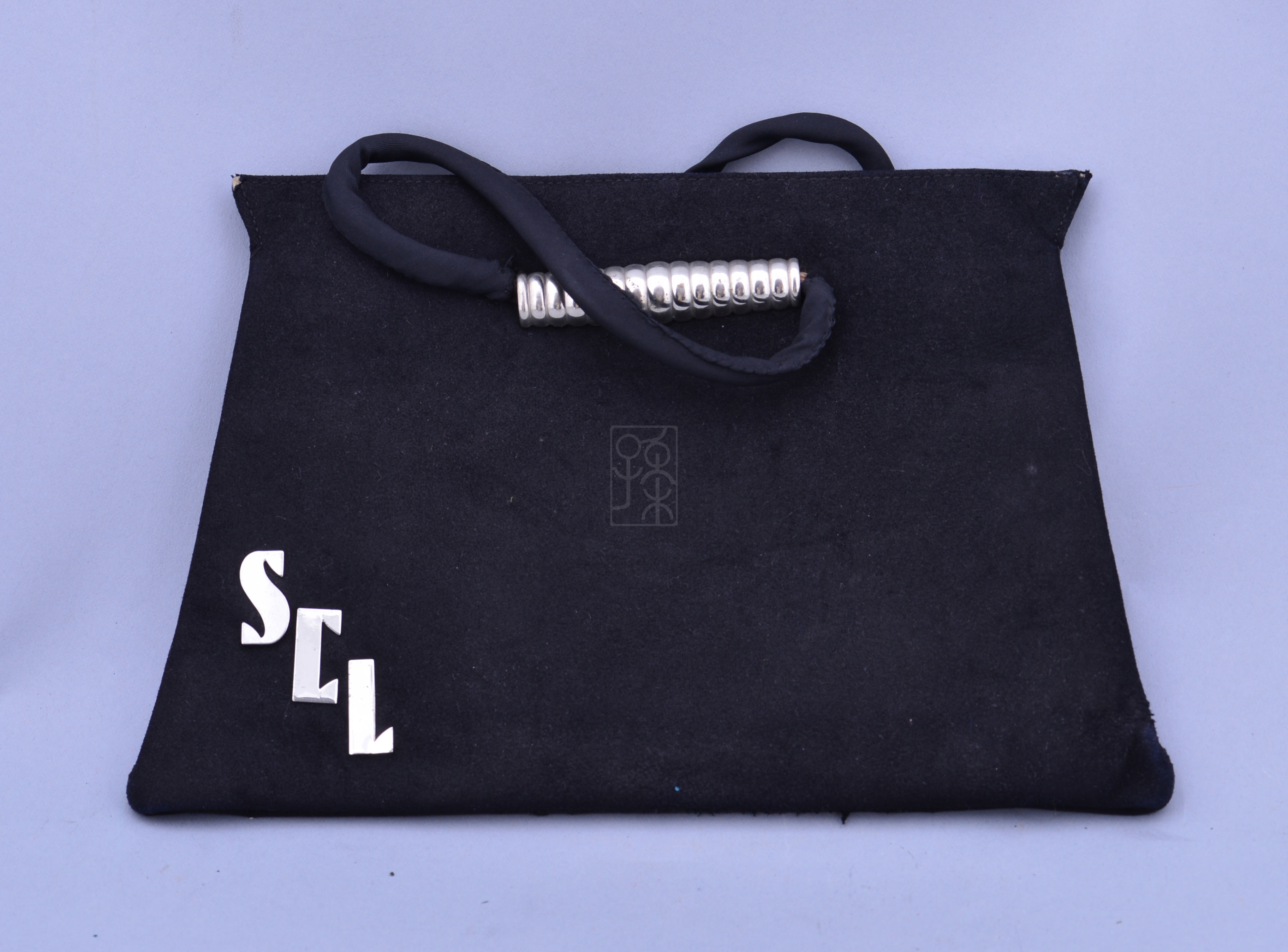 宋庆龄使用过的“SCL”手袋
